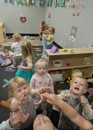 Children at play together in classroom